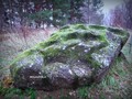камень