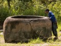 03 Indonesian man inspecting a kalamba near Kolori village, Bada Valley